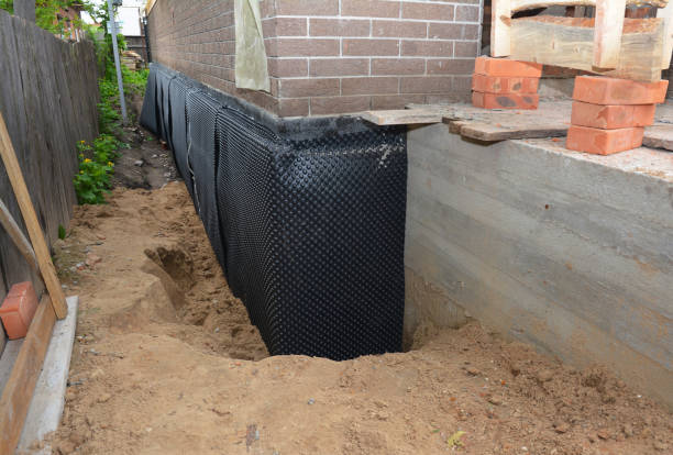 SJ Waterproofing Pros technician performing targeted Emergency Waterproofing assessment in Genesee, MI